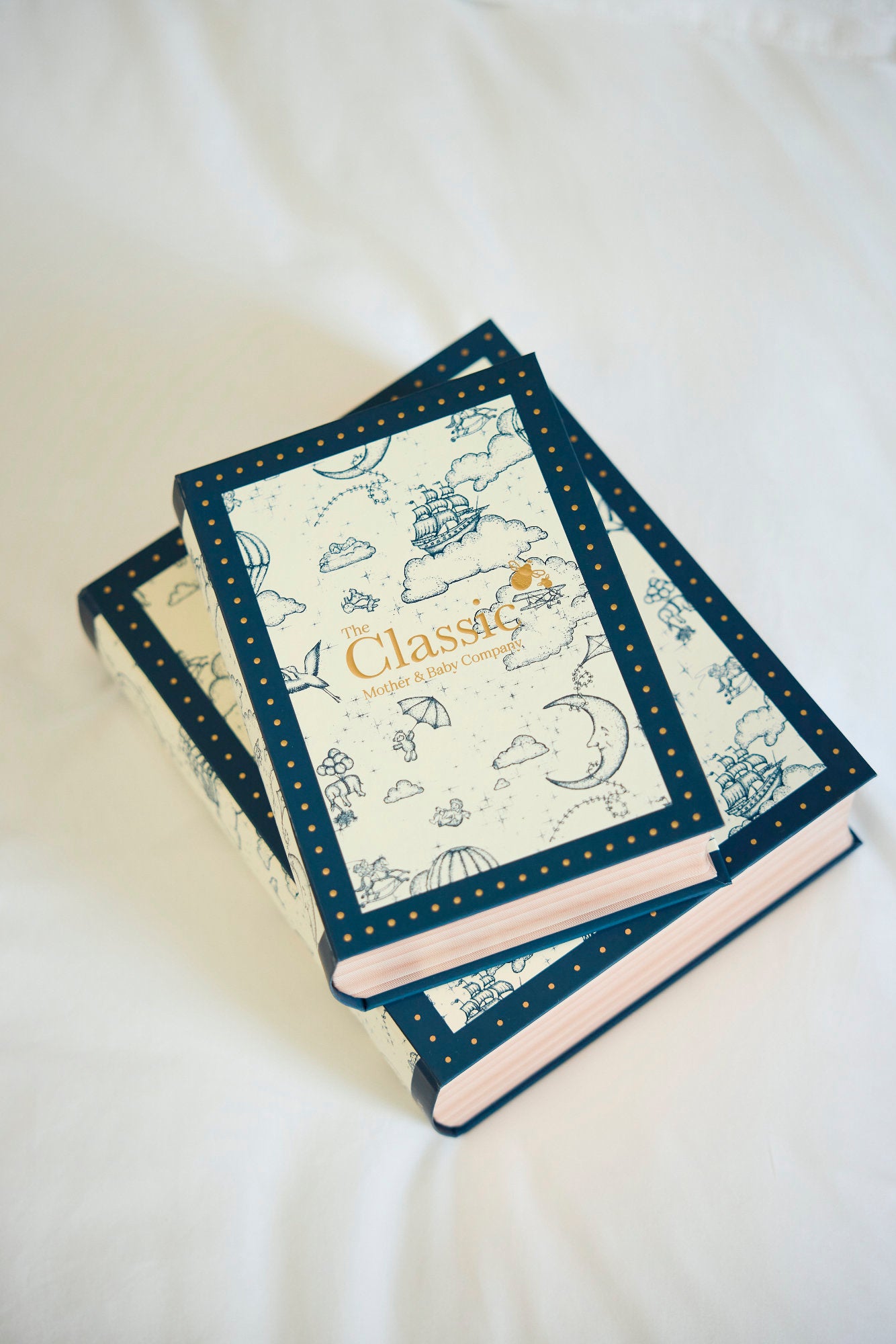 Two decorative books with a 'Classic' title on a white surface