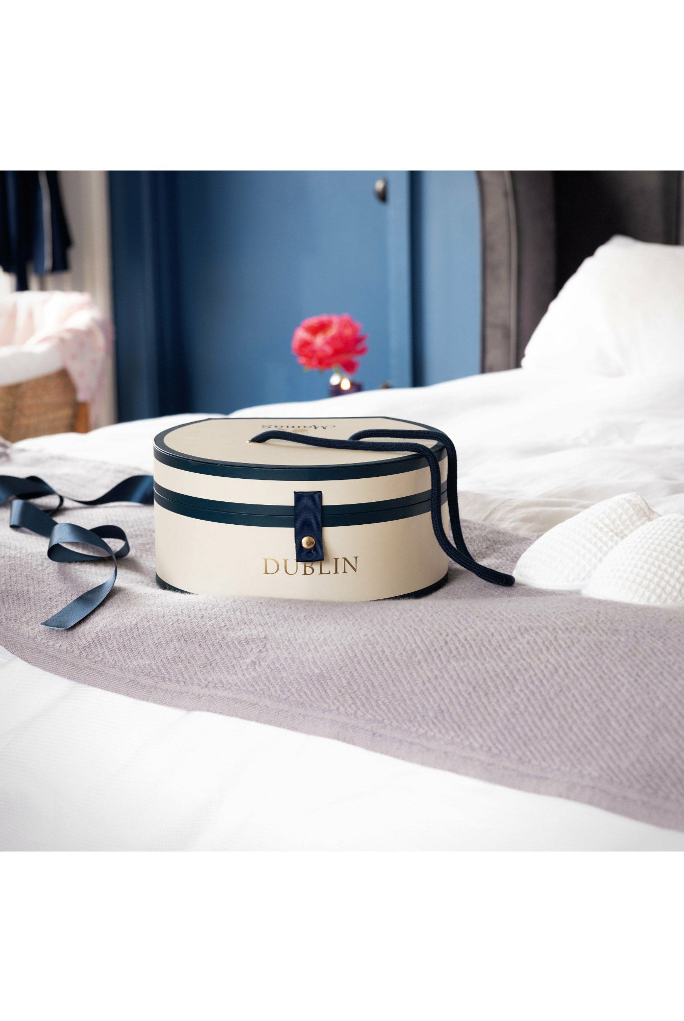 Dublin Hat Box on bed with white slippers- Mamas Hospital Bag