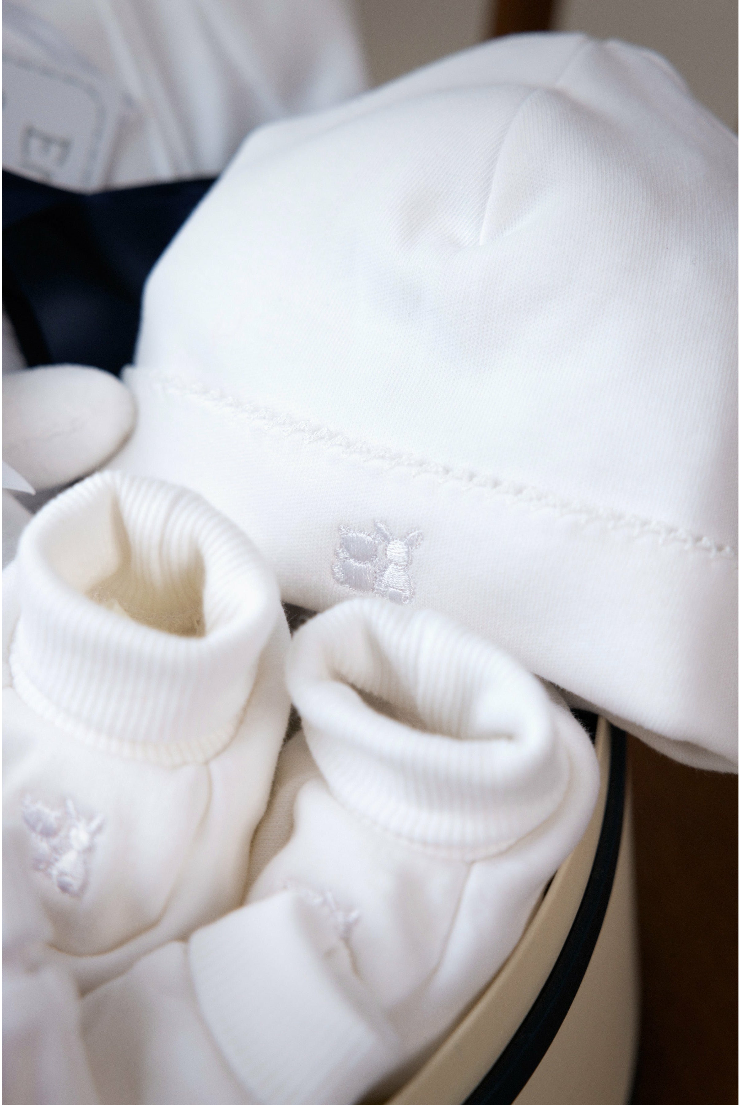 white baby booties and hat in baby gift box- Mamas Hospital Bag