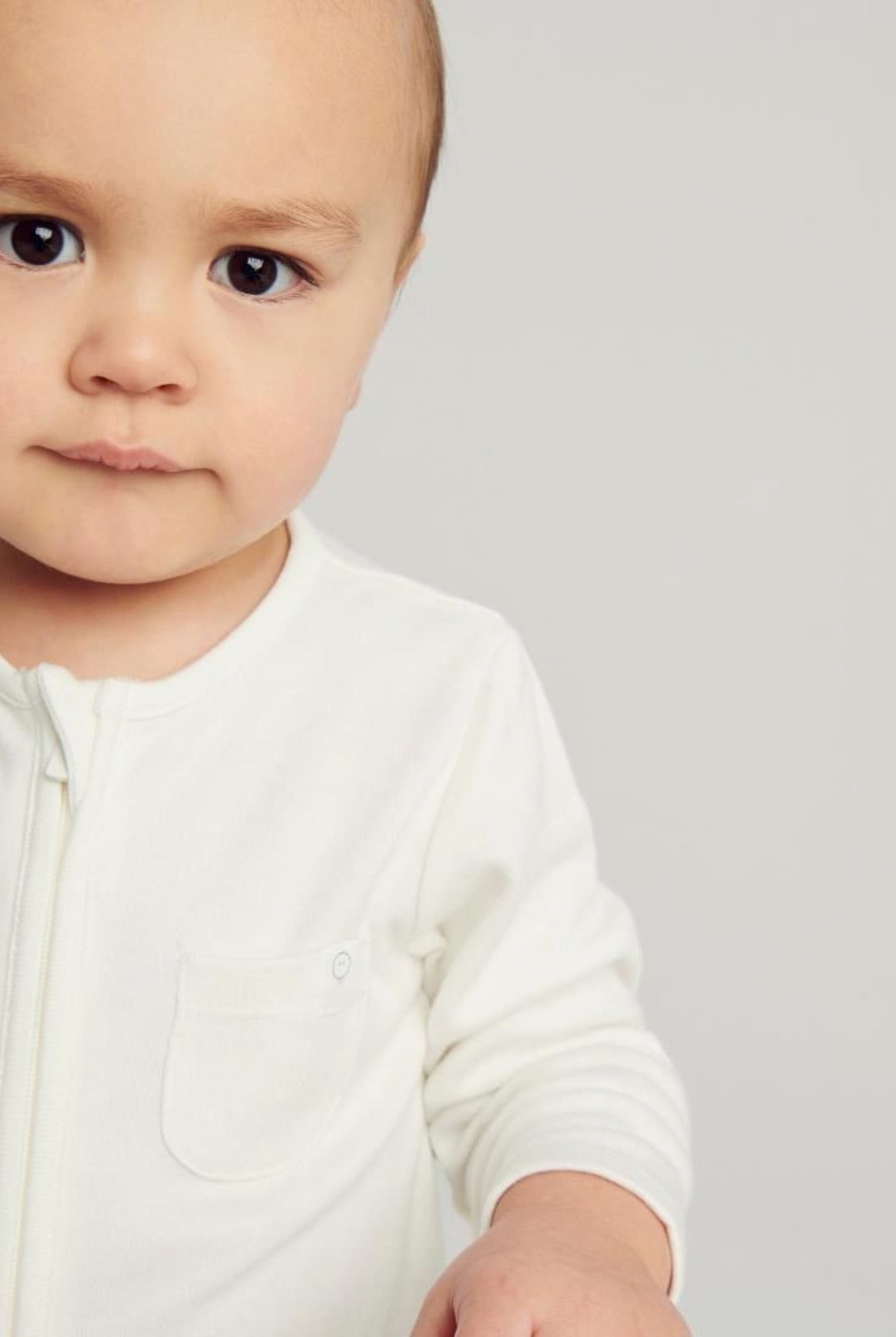 Baby in White Babygro - Mamas Hospital Bag Ireland