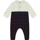 Baby romper with white top and navy blue plaid pattern on a white background
