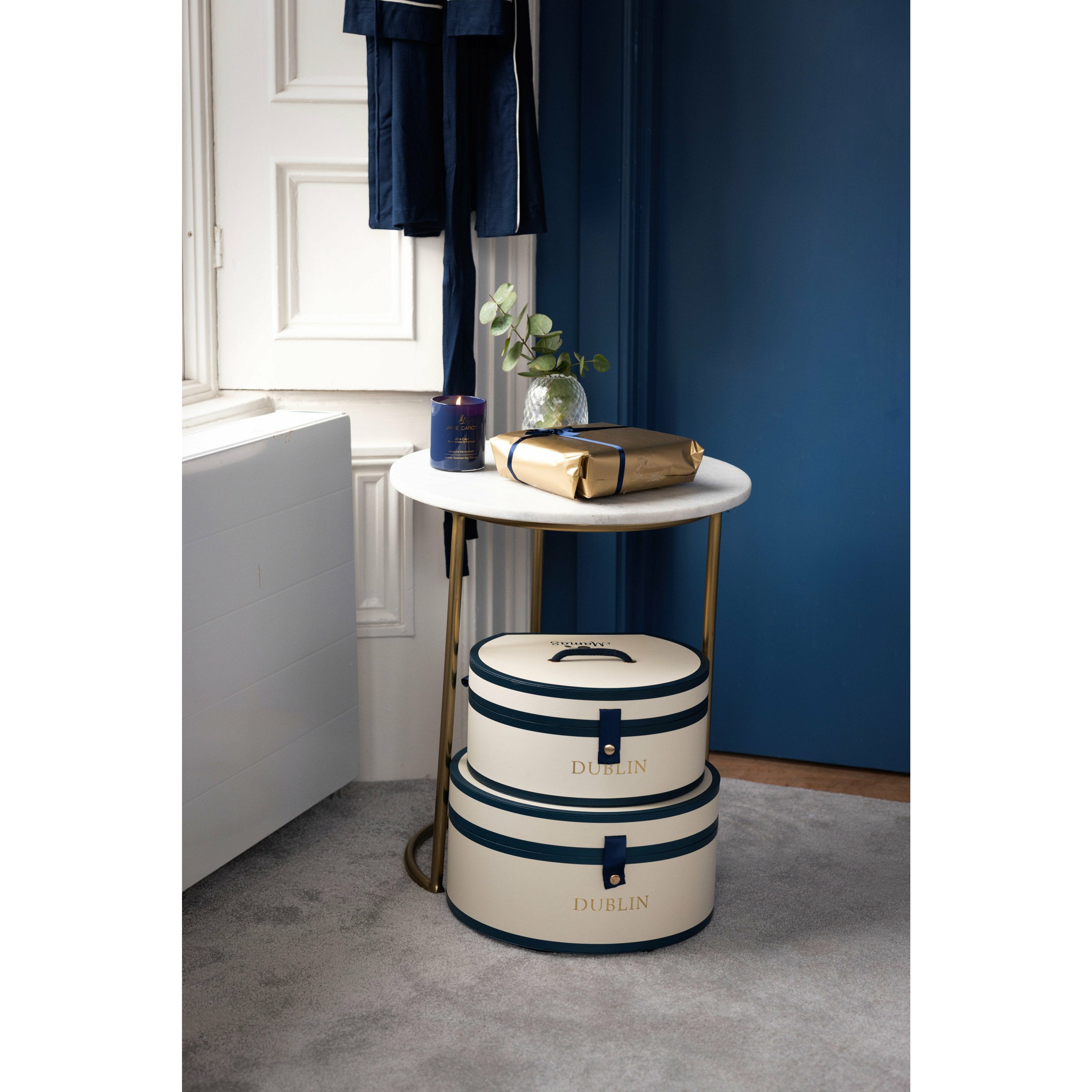 Hat boxes stacked in bedroom with navy dressing gown- Mamas Hospital Bag Baby Gift Dublin Ireland