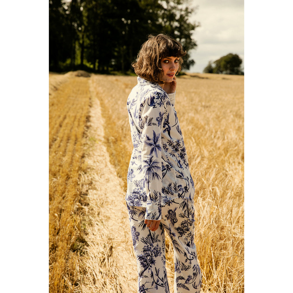 model in field wearing blue and white pyjamas