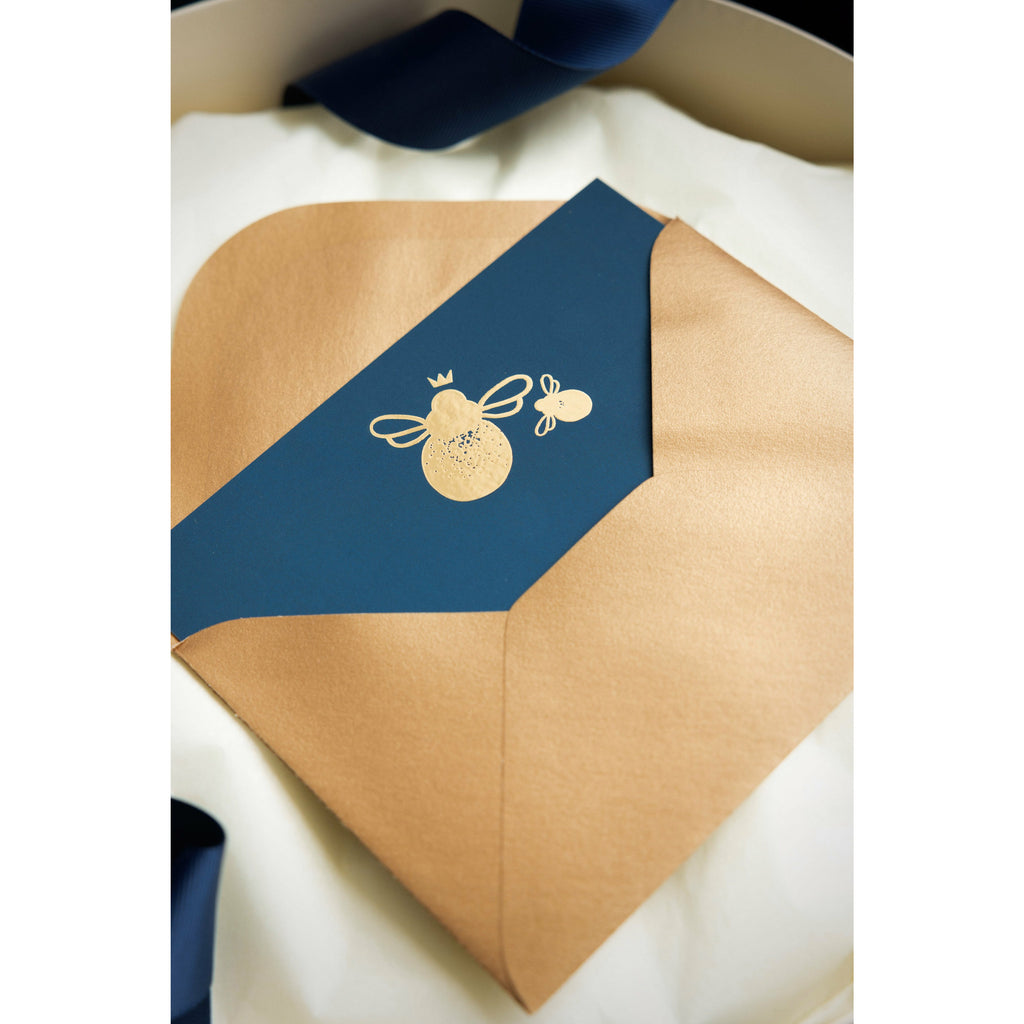 Gold envelope and navy card with gold bees- Mamas Hospital Bag 