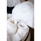 white baby booties and hat in baby gift box- Mamas Hospital Bag