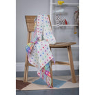 White foxford blanket on seat - Mamas Hospital Bag Ireland