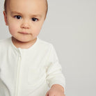 Baby in White Babygro - Mamas Hospital Bag Ireland