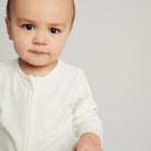 Baby in White Babygro - Mamas Hospital Bag Ireland